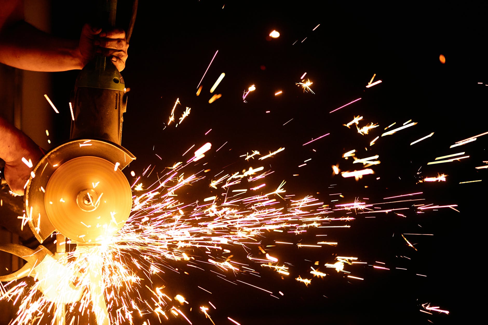 flashing sparks coming from the angle grinder
